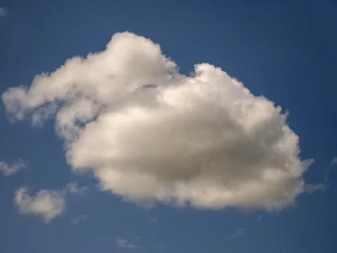 White fluffy cloud over blue summer sky background Stock Photos