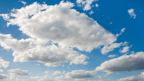 White fluffy clouds and blue sky time lapse Stock Footage 77749929