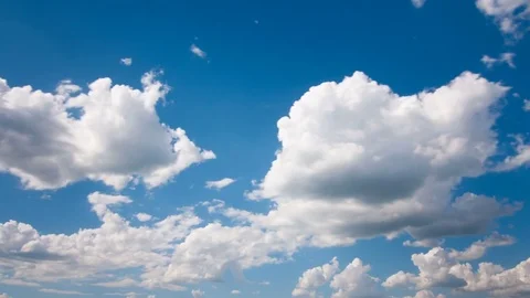 White fluffy clouds and blue sky time lapse Video stock 77749938