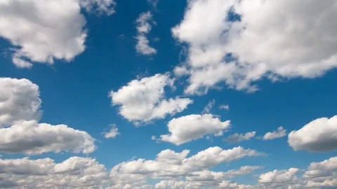 White fluffy clouds and blue sky time lapse Stock Footage 77750254