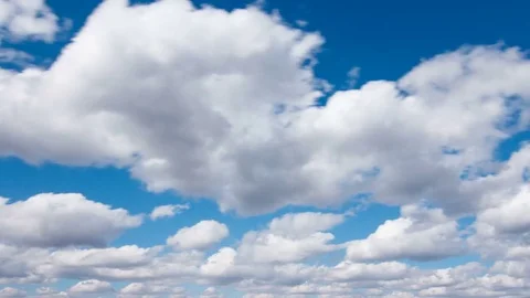 White fluffy clouds and blue sky time lapse Stock Footage 77794634