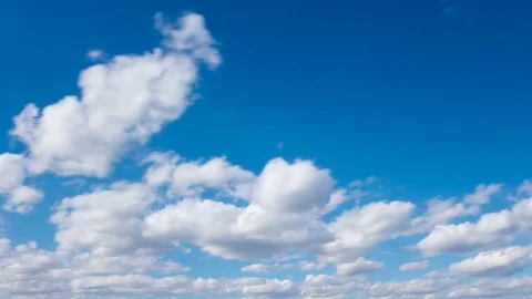 White fluffy clouds and blue sky time lapse Stock Footage 77794667
