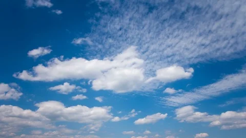 White fluffy clouds and blue sky time lapse Stock Footage 77794675