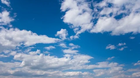 White fluffy clouds and blue sky time lapse Stock Footage 77794684