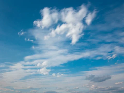 White fluffy clouds and blue sky time lapse Stock Footage 77794712