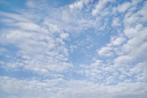 White fluffy clouds on background blue sky Stock Photos