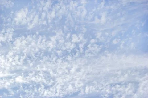 White fluffy clouds on background sky. Stock Photos