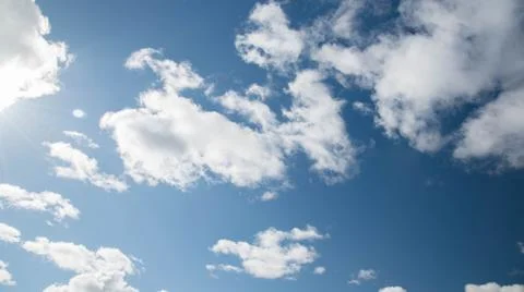 White fluffy clouds in blue sky Foto stock