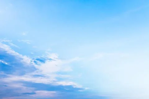 White fluffy clouds in the blue sky Stock Photos