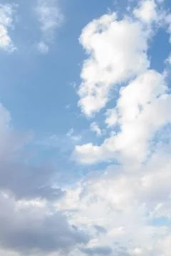 White fluffy clouds in the blue sky in summer Stock Photos