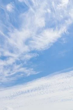 White fluffy clouds in the blue sky in summer Stock Photos
