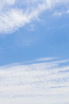 White fluffy clouds in the blue sky in summer Stock Photos