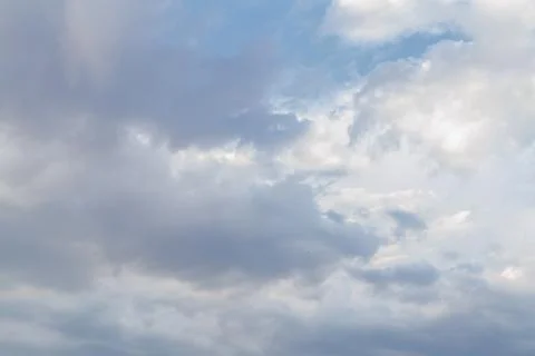 White fluffy clouds in the blue sky in summer Stock Photos