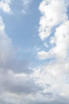 White fluffy clouds in the blue sky in summer Stock Photos