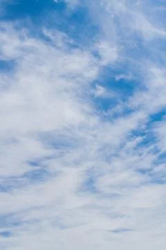 White fluffy clouds in the blue sky in summer Stock Photos