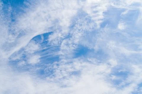 White fluffy clouds in the blue sky in summer Stock Photos