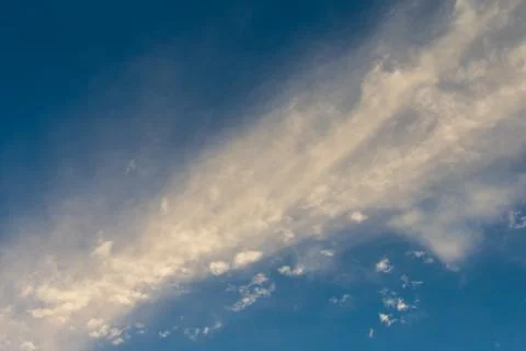White fluffy clouds in the blue sky Stock Photos