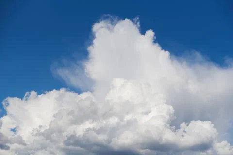White fluffy clouds in the blue sky Stock Photos