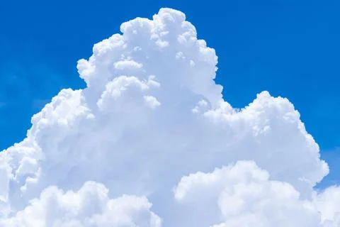 White fluffy clouds on blue sky. Soft touch feeling like cotton. White puffy  Foto stock