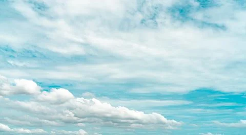 White fluffy clouds on blue sky. Soft touch feeling like cotton. White puffy  Foto stock