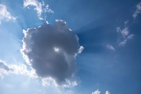 White fluffy clouds in the blue sky Stock Photos