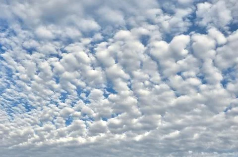 White fluffy clouds on a blue sky background 스톡 사진