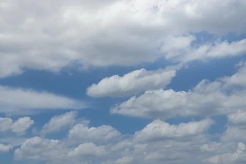 White fluffy clouds with blue sky on sunny day, beautiful summer cloudy sky.. Stock Photos