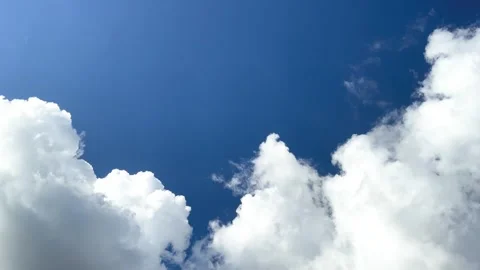 White Fluffy Clouds Border On Blue Sky With A Flock Of Little Birds Fly Stock Footage 276758706