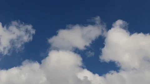 White fluffy clouds on a bright blue sky Video stock 104644390