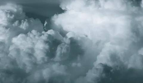 White fluffy clouds on dark sky. Soft touch feeling like cotton. Stormy sky b Stock-Fotos