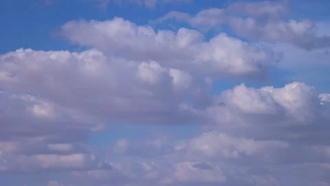 White Fluffy Clouds Float Through The Blue Daytime Sky Timelapse Stock Footage 278808411