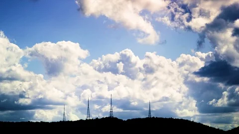 White fluffy clouds floating over factory Stock-Footage 76104112