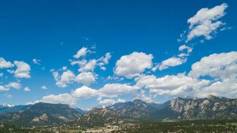 White Fluffy Clouds in Mountain Range of Colorado Stock Photos