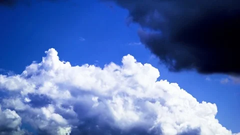 White fluffy clouds moving in blue sky Stock Footage 76104081