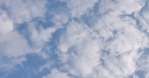 White fluffy clouds moving in the blue sky Stock Footage 159179264