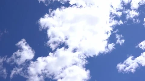 White fluffy clouds moving on deep blue sky background Stock Footage 275198685