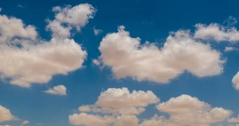 White fluffy clouds moving out in the sky Stock Footage 90964995