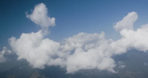 White fluffy clouds moving in the sky Stock Footage 145267109