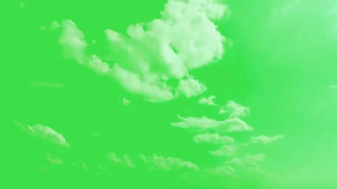 White fluffy clouds moving slowly on green screen background for video editing Stock Footage 329964953
