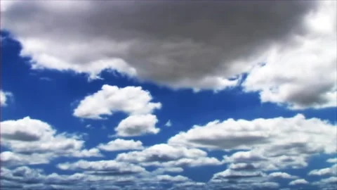 White fluffy clouds moving softly on the sky and the sun shining Stock Footage 280330475