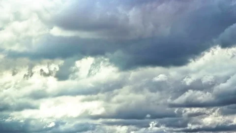 White fluffy clouds moving in sunny sky Stock Footage 76105684