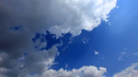 White fluffy clouds over blue sky Stock Footage 940536