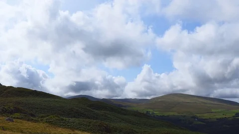 White fluffy clouds over the hills. Stock Footage 80999956