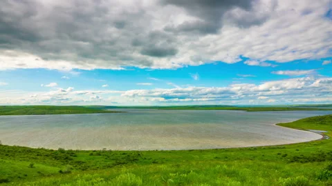 White Fluffy Clouds over the Lake Stock Footage 155489592