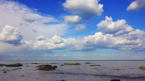 White Fluffy Clouds over the Sea. Stock Footage 75667124