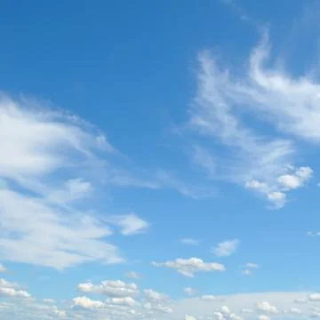 White fluffy clouds Stock Photos