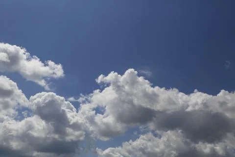 White fluffy clouds Stock Photos