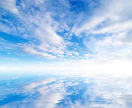 White fluffy clouds with rainbow in the blue sky Stock Photos