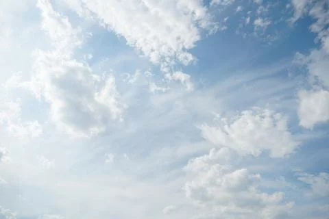 White fluffy clouds in the sky. Blue sky and cloud cover on a sunny summer .. 写真素材