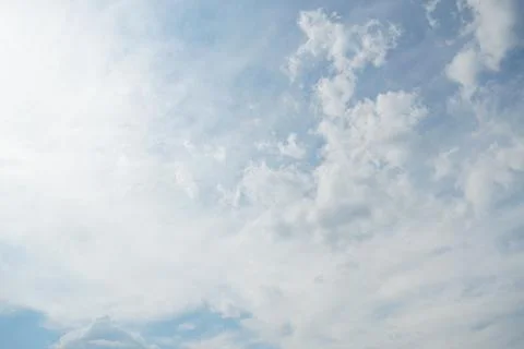 White fluffy clouds in the sky. Blue sky and cloud cover on a sunny summer .. 写真素材